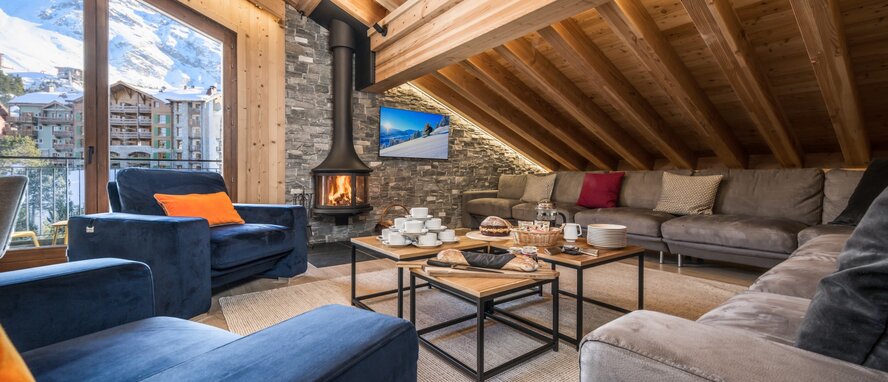 Afternoon tea in front of a log fire in Penthouse Misha, Arcs 1950