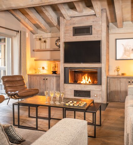 Contemporary open plan living area with open fire in Loft 2 Aspen House Val d'Isere