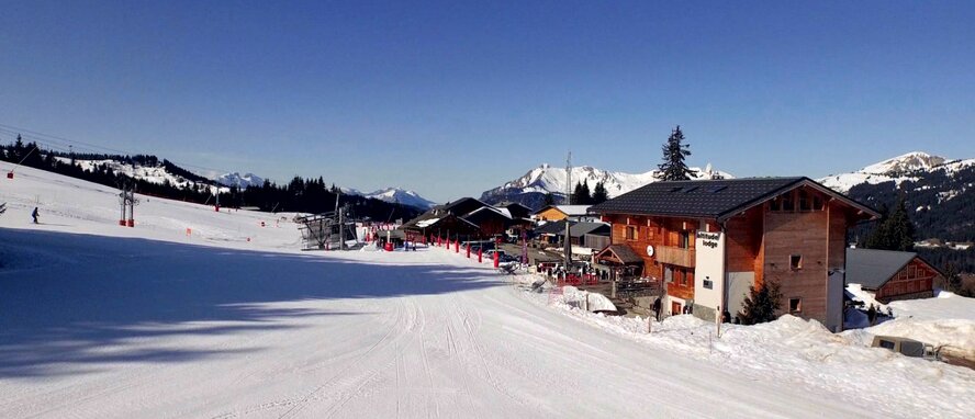 Ski lifts and piste in front of Altitude Lodge