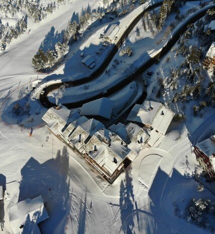 Aerial view of Bear Lodge ski hotel in Arc 1950