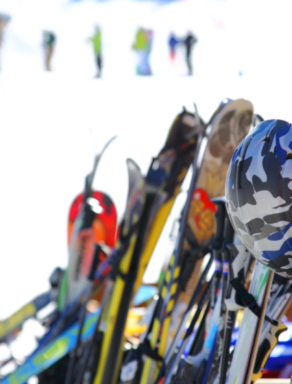 Skis and helmets outside mountain restaurant