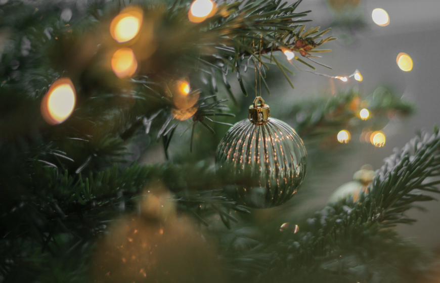 Silver Christmas bauble on real Christmas tree