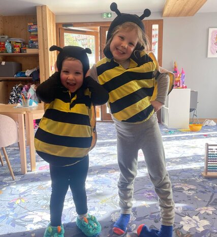 Two smiling children wearing bumble bee costumes in Bear Cubs in Arc 1950