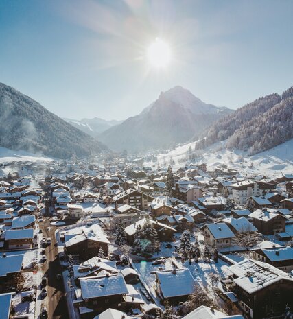 Aerial view of Morzine town in winter on a sunny day 