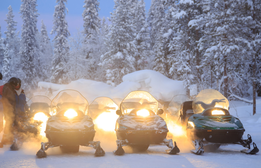 Snowmobiles ready for evening tour
