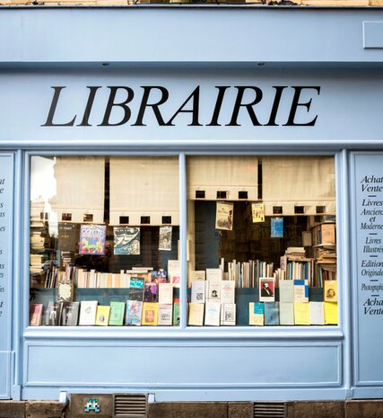 Picturesque blue exterior of bookshop in Reims