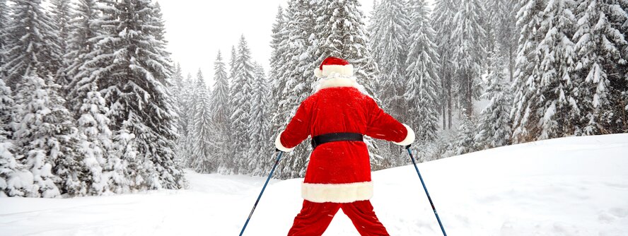 Santa skiing in the Alps at Christmas