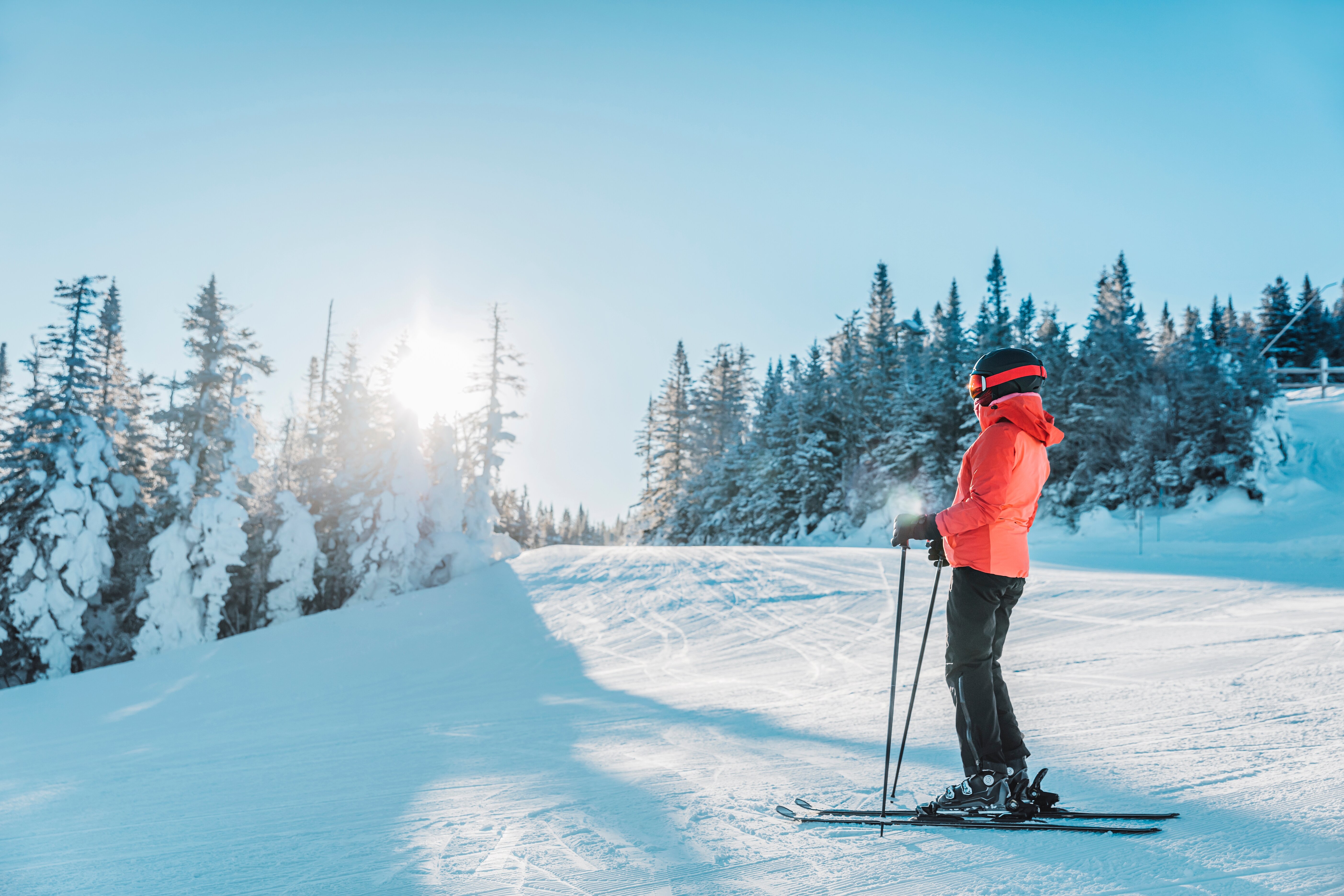 Female skier stood on the piste