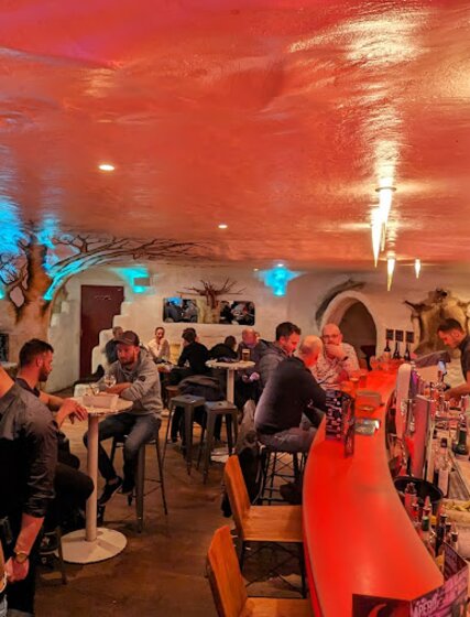 Customers enjoying drinks at Igloo-themed bar, Igloo Igloo in La Plagne