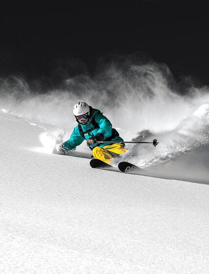 Skier enjoying powder turns