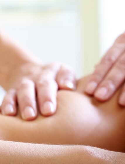 Woman with eyes closed enjoying massage