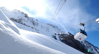 View from below of Olympique cable car in Val d'Isere