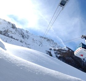 View from below of Olympique cable car in Val d'Isere