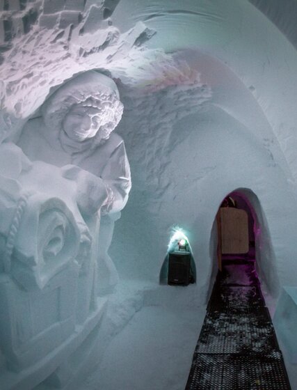 Igloo with snow carvings and a viewing walkway