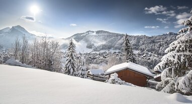 Snowy view from the distance of Morzine in the sunshine